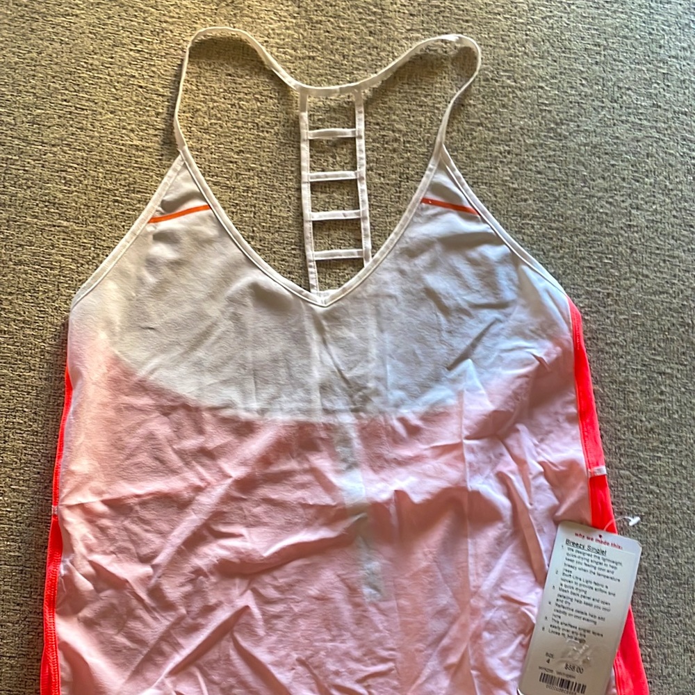 NWT, Adorable, Lululemon tank top size 4. $65. Breezy singlet.